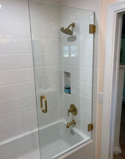 Shower enclosure with gold fixtures